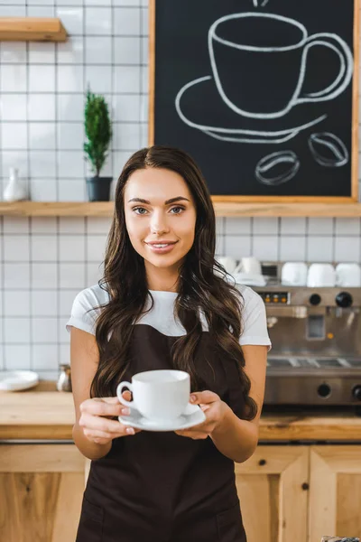 Attractive Barista Brown Apron Holding Cup Saucer Coffee House — Stock Photo, Image