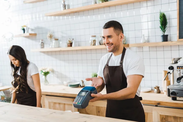 Handsome Cashier Standing Bar Counter Pointing Terminal Hand Wile Brunette — Stock Photo, Image