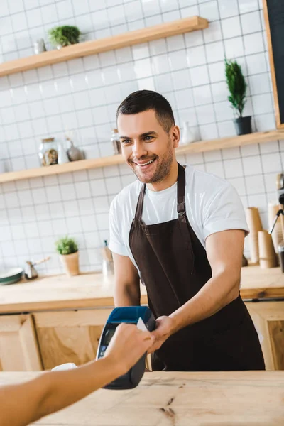 Handsome Cashier Standing Bar Counter Holding Terminal Wile Woman Paying — Stock Photo, Image