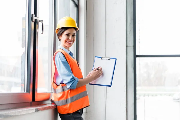 Cheerful Female Firefighter Helmet Uniform Holding Clipboard Blank Paper — Stock Photo, Image