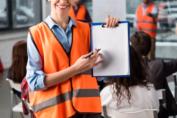 Cropped View Cheerful Female Firefighter Pointing Blank Clipboard Pen Coworkers — Stock Photo, Image