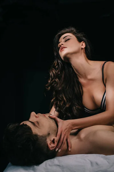 Beautiful Seductive Woman Touching Neck Man Bed Isolated Black — Stock Photo, Image