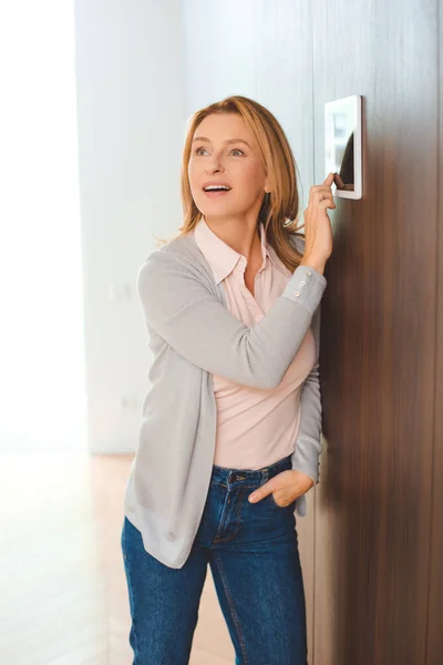 Pretty Blonde Woman Using Smart Home Control Panel Holding Hand — Stock Photo, Image