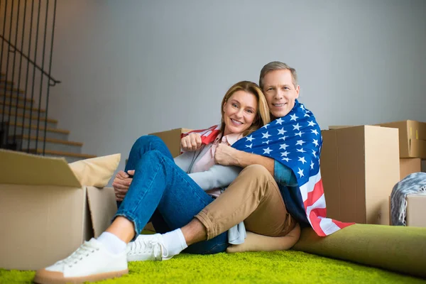 Happy Couple Wrapping Usa National Flag Looking Camera — Stock Photo, Image