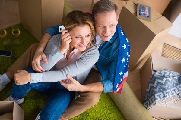 Happy Woman Holding Keys House Model Trinket While Sitting Floor — Stock Photo, Image