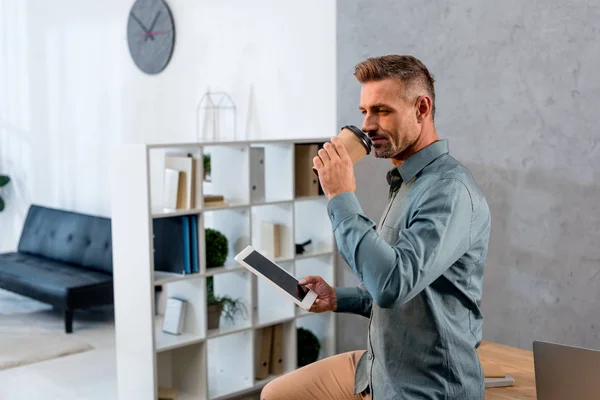 Handsome Businessman Drinking Coffee Drom Disposable Cup Holding Digital Tablet — Stock Photo, Image