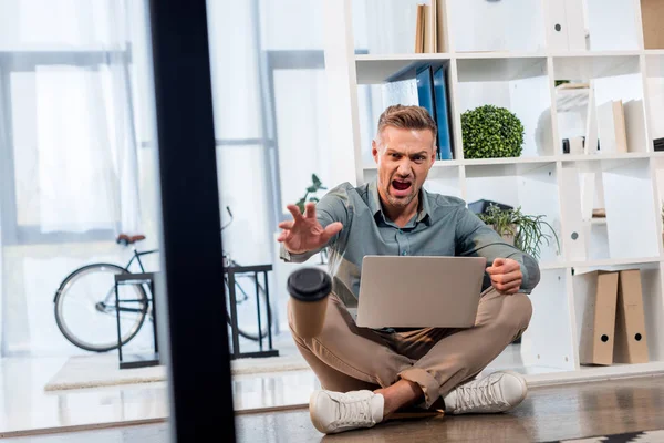 Angry Businessman Sitting Crossed Legs Floor Throwing Paper Cup — Stock Photo, Image