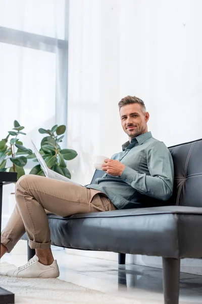 Happy Businessman Sitting Sofa Holding Cup Drink While Looking Camera — Stock Photo, Image