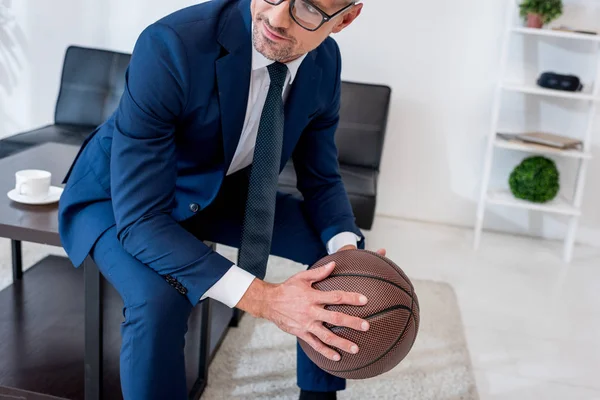 Cropped View Businessman Glasses Suit Holding Basketball Hands While Sitting — Stock Photo, Image