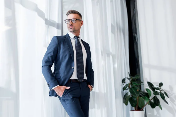 Confident Businessman Suit Glasses Standing Hands Pockets — Stock Photo, Image