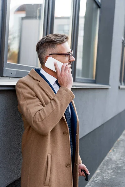 Handsome Businessman Glasses Talking Smartphone While Standing Beige Coat — Stock Photo, Image