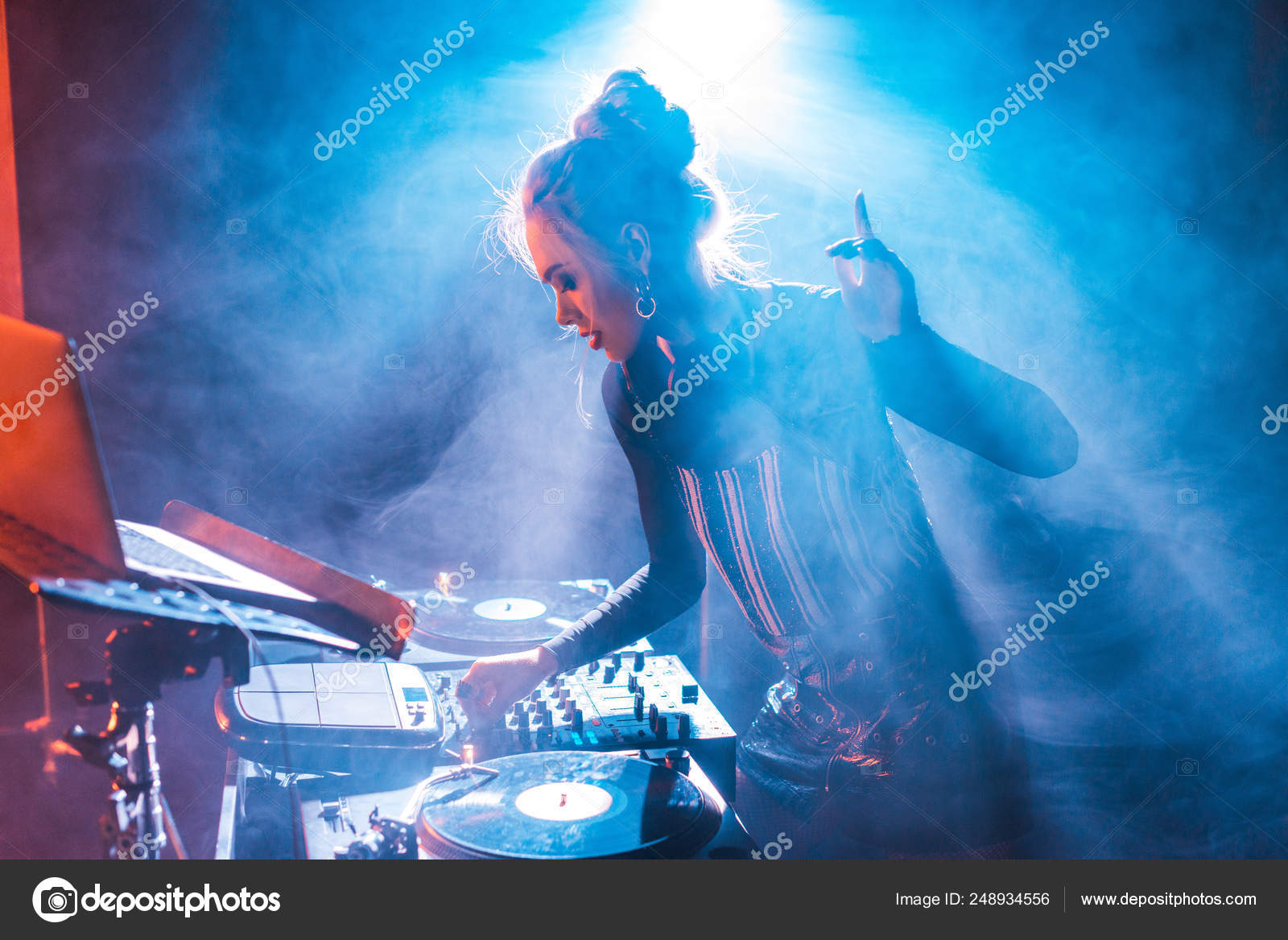 Concentrated Woman Blonde Hair Gesturing Using Equipment Nightclub