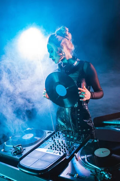 Blonde Woman Looking Equipment Holding Retro Vinyl Record Nightclub Smoke — Stock Photo, Image