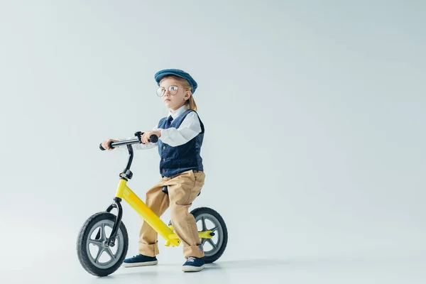 Thoughtful Kid Retro Vest Cap Riding Bicycle Looking Away — Stock Photo, Image