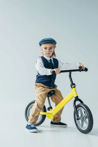 Kid Retro Vest Cap Riding Bike Looking Camera Grey Background — Stock Photo, Image