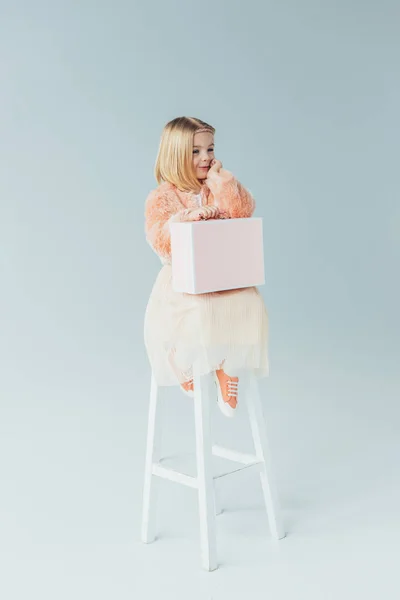 Dreamy Kid Faux Fur Coat Skirt Sitting Highchair Holding Pink — Stock Photo, Image