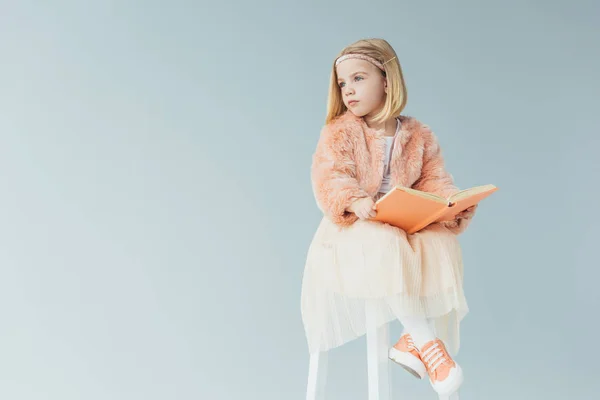 Kid Faux Fur Coat Skirt Sitting Highchair Holding Book Isolated — Stock Photo, Image