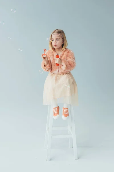Kid Faux Fur Coat Skirt Sitting Highchair Blowing Soap Bubbles — Stock Photo, Image