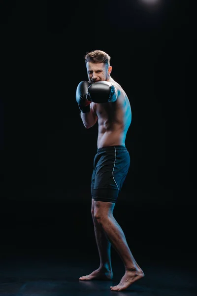Muscular Shirtless Strenuous Boxer Boxing Gloves Doing Punch Black — Stock Photo, Image
