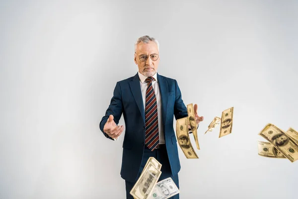 Selective Focus Mature Businessman Glasses Throwing Air Dollar Banknotes Isolated — Stock Photo, Image