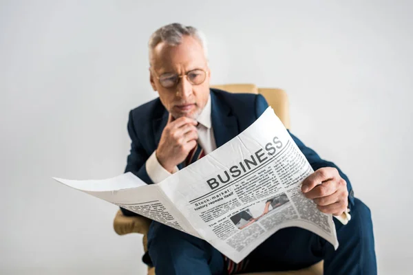 Selective Focus Mature Businessman Glasses Reading Business Newspaper Isolated Grey — Stock Photo, Image