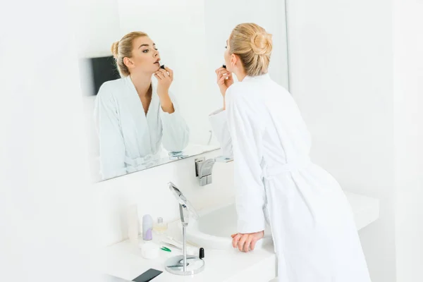 Selective Focus Beautiful Blonde Woman White Bathrobe Applying Lipstick Bathroom — Stock Photo, Image