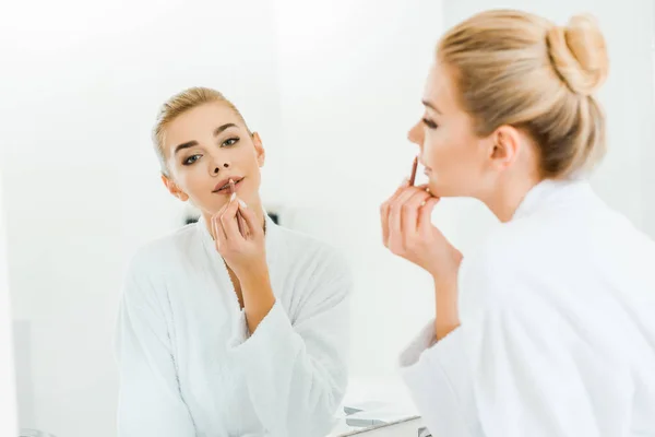 Selective Focus Beautiful Blonde Woman White Bathrobe Applying Lip Liner — Stock Photo, Image