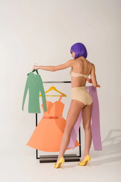 Back View Girl Purple Hair Posing Rack Colorful Paper Clothes — Stock Photo, Image