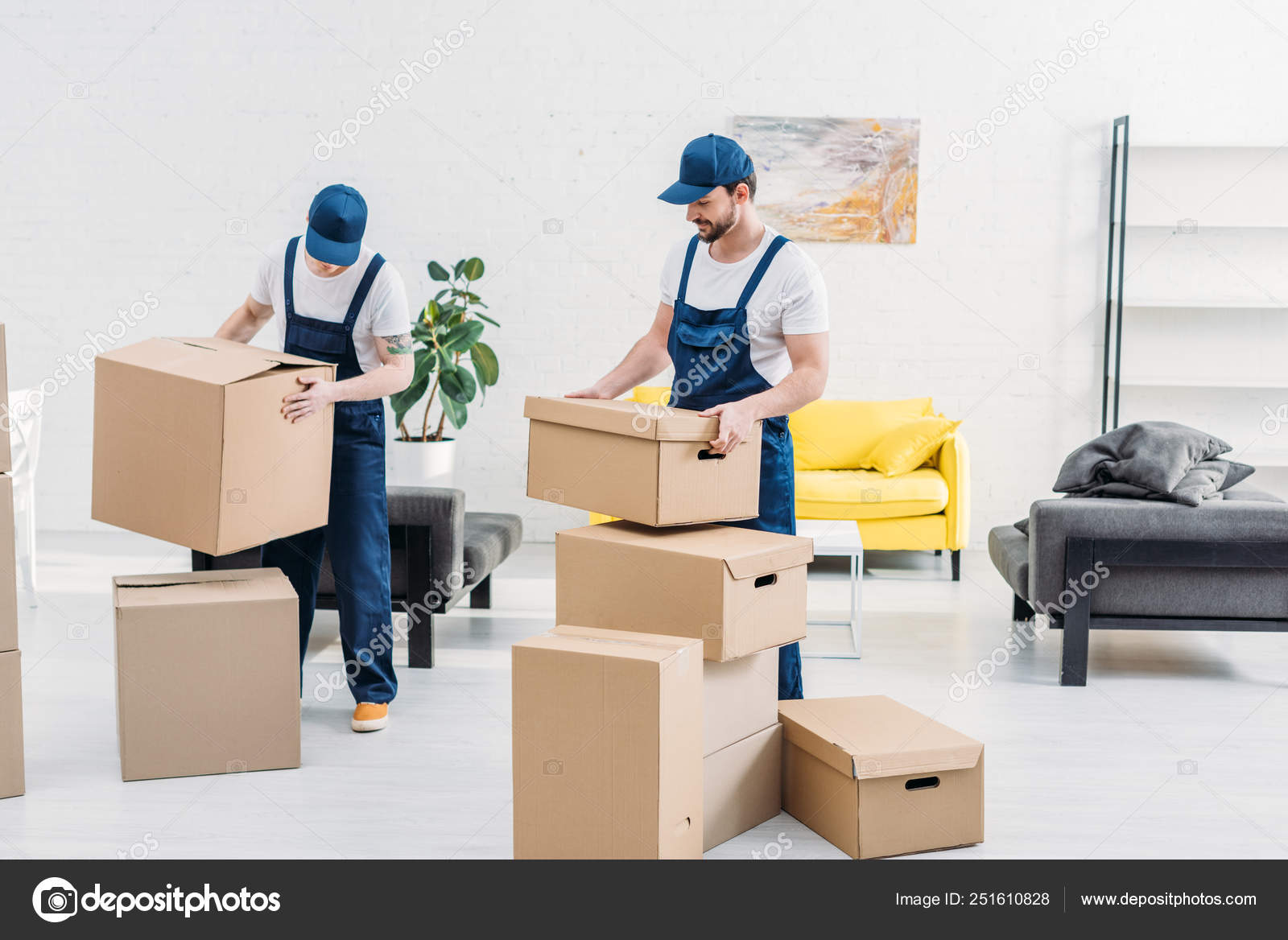 Two Movers Uniform Carrying Cardboard Boxes Modern Apartment Stock Photo C Vitalikradko 251610828
