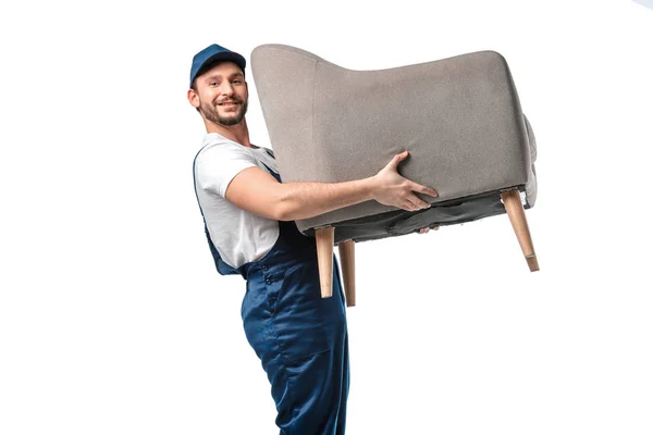 Handsome Mover Uniform Looking Camera While Carrying Grey Armchair Isolated — Stock Photo, Image