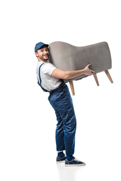 Handsome Mover Uniform Looking Camera While Carrying Grey Armchair Isolated — Stock Photo, Image