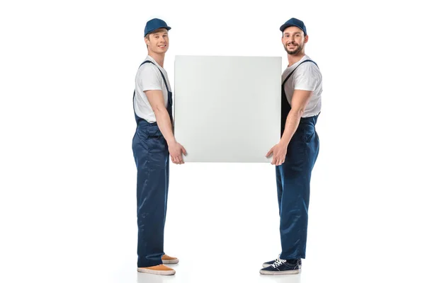 Two Smiling Movers Looking Camera While Holding Blank Box Isolated — Stock Photo, Image