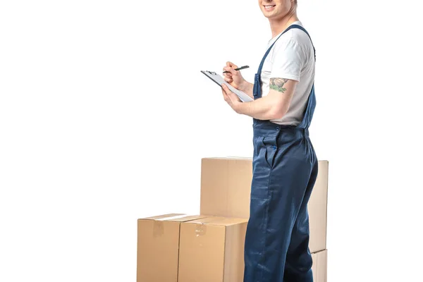 Cropped View Mover Uniform Writing Clipboard Cardboard Boxes Isolated White — Stock Photo, Image