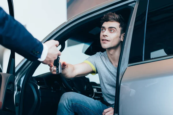 Cropped View Car Dealer Giving Keys Successful Handsome Man Sitting — Stock Photo, Image