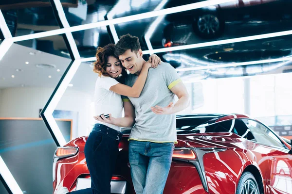 Happy Curly Woman Hugging Handsome Man While Standing Automobile — Stock Photo, Image