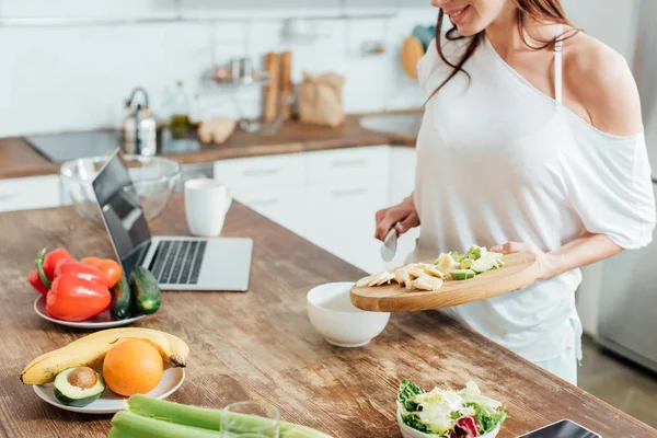 Cropped View Cheerful Girl Holding Chopping Board Cut Bananas Avocados — Stock Photo, Image