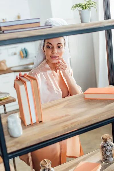 Curious Woman Housecoat Towel Head Choosing Book — Stock Photo, Image