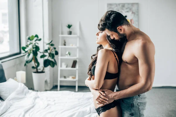 Bearded Man Hugging Sexy Girlfriend Closed Eyes Bedroom — Stock Photo, Image