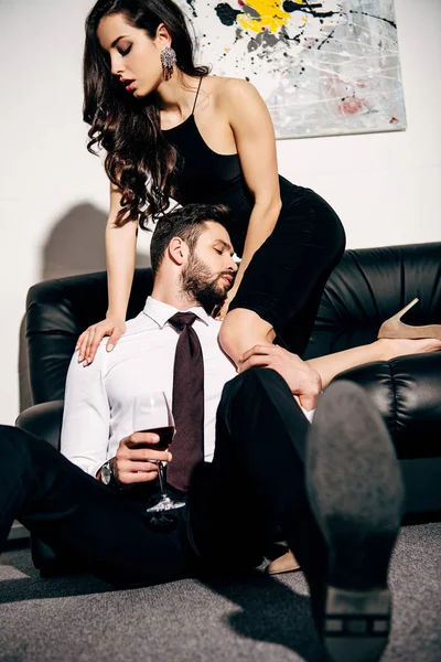 Beautiful Woman Sitting Sofa Heels Handsome Boyfriend Holding Glass Wine — Stock Photo, Image