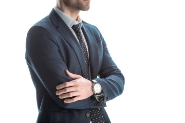 beyaz izole çapraz kolları ile takım elbiseli işadamı kısmi görünümü