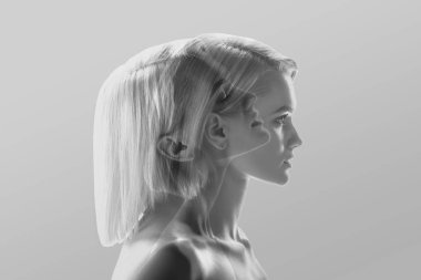 multiple exposure of beautiful blonde woman profile on grey clipart