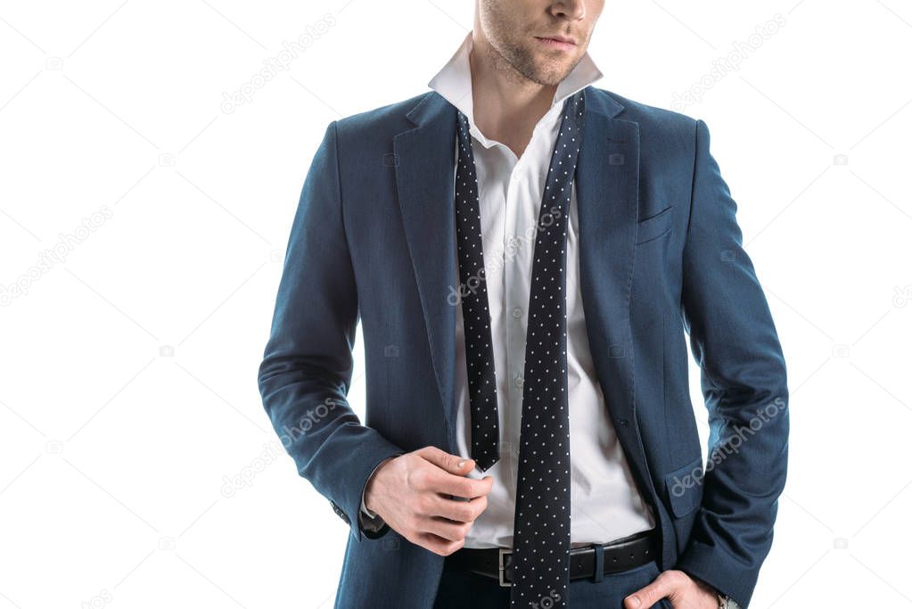 partial view of confident businessman with untied tie isolated on white