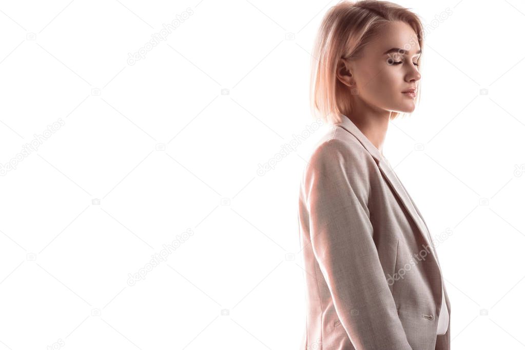 beautiful, pensive businesswoman with closed eyes isolated on white