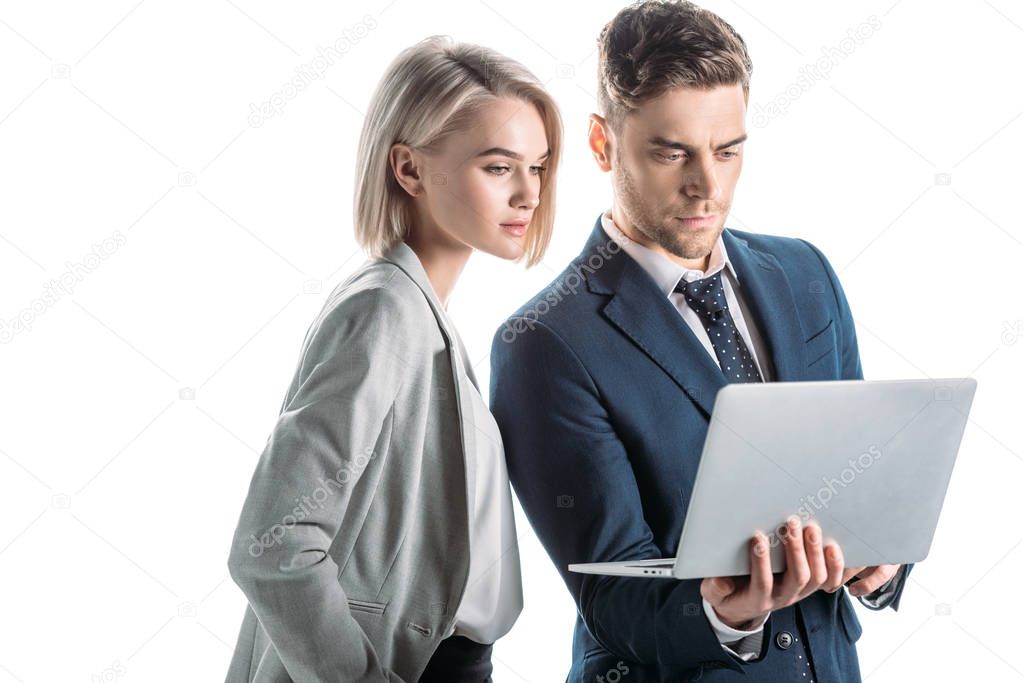 young, confident business partners using laptop isolated on white