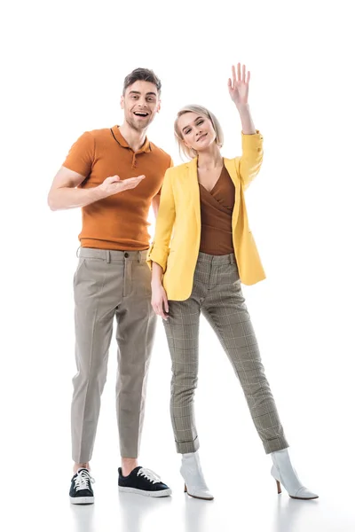 Cheerful Young Woman Waving Hand While Standing Handsome Man Isolated — Stock Photo, Image