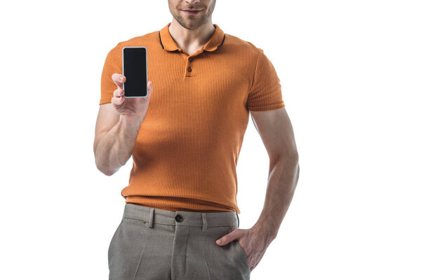 cropped view of man with hand in pocket holding smartphone with blank screen isolated on white