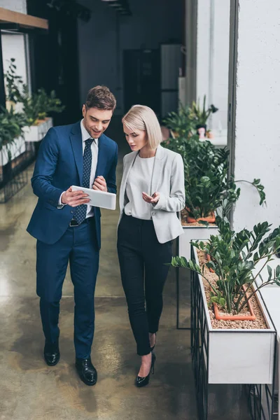 Two Young Business Partners Using Digital Tablet Together Office — Stock Photo, Image