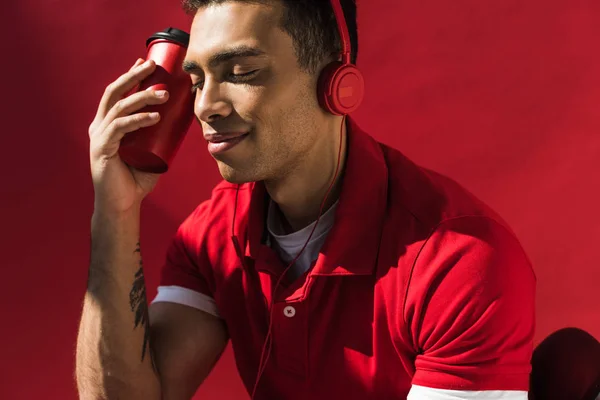 Stylish Mixed Race Man Headphones Eyes Closed Holding Coffee Red — Stock Photo, Image