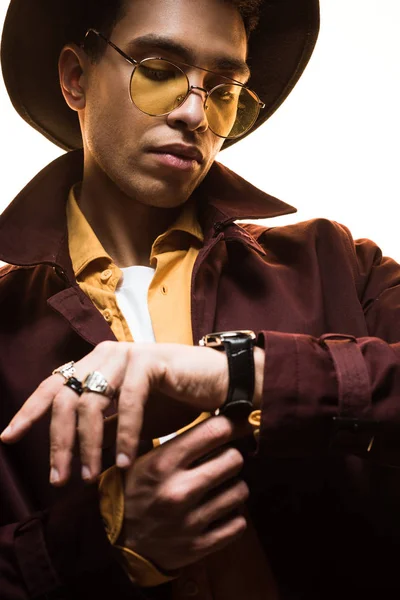 Stylish Mixed Race Man Hat Sunglasses Putting Watch Isolated White — Stock Photo, Image