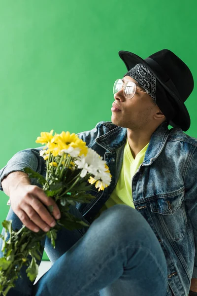 Stylish Mixed Race Man Denim Posing Flowers Green Screen — Stock Photo, Image